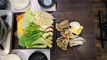 Fresh and delicious broth hot pot at a Japanese restaurant, featuring locally seasonal organic...