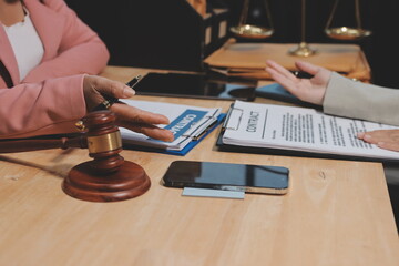 Consultation and conference of professional businesswoman and Male lawyers working and discussion having at law firm in office. Concepts of law, Judge gavel with scales of justice