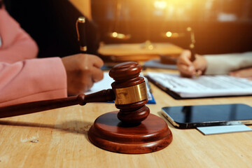 Consultation and conference of professional businesswoman and Male lawyers working and discussion having at law firm in office. Concepts of law, Judge gavel with scales of justice