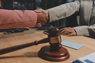 Consultation and conference of professional businesswoman and Male lawyers working and discussion having at law firm in office. Concepts of law, Judge gavel with scales of justice