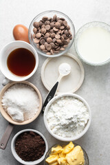 Overhead view of mise en place of ingredients for making chocolate mud cake, process of make dark chocolate mud cake