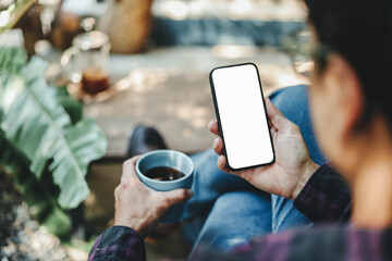 Mobile phone blank white screen mockup.texting using cell phone.background empty space for...