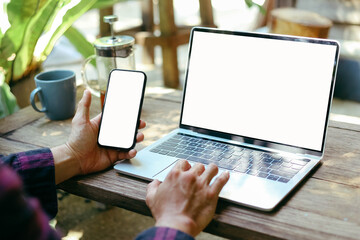 computer screen,mobile phone blank mockup.work using laptop texting mobile.white background for advertising,contact business search information on desk in cafe.marketing,design