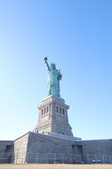 Obraz premium Statue of Liberty at sunset in New York City, USA