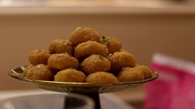 Balushahi or makkhan bada beautifully decorated with a festive celebration background 