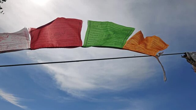 Slow motion video of Religious tibetan buddhist prayer flags in Altai mountains.