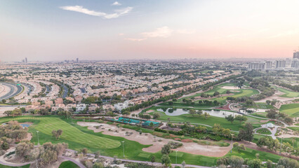 Aerial view to villas and houses with Golf course with green lawn and lakes timelapse