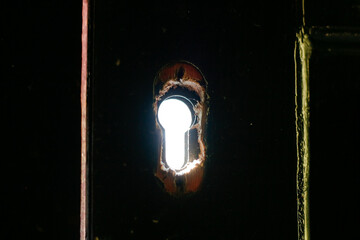 close up broken door keyhole