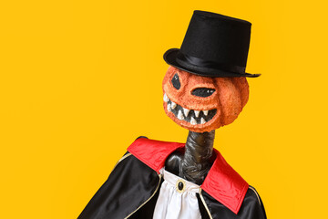 Spooky Halloween monster in costume on yellow background