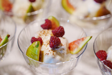 Delicious dessert with fresh fruit and creamy ice cream at a festive gathering