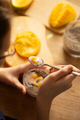 Mango chia pudding with coconut milk served in glass
