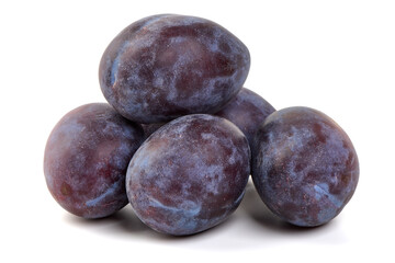 Obraz premium Ripe Plums Stacked, isolated on white background
