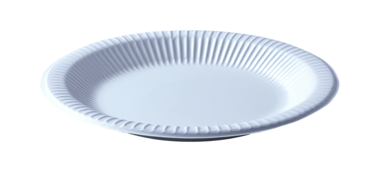 An isolated image showing a white disposable plate with a ridged rim, angled against a black background