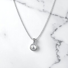 Simple pearl pendant necklace on marble