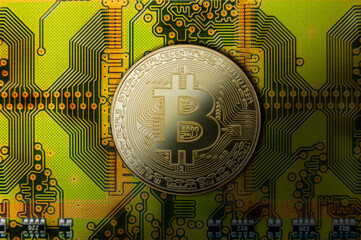 Digital currency symbol displayed on a vibrant circuit board representing blockchain technology and its applications