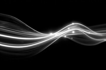 Abstract waves of light streak across a dark background, showing movement and energy through shining curves
