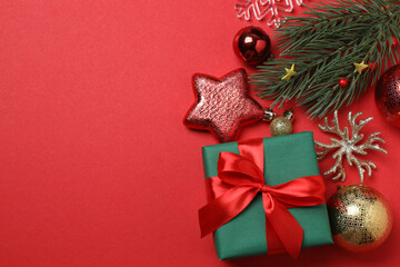 Festive scene with wrapped gifts, candies and decorations, sometimes on a bright red background,...