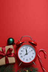 Festive scene with wrapped gifts, candies and decorations, sometimes on a bright red background, conveying Christmas greetings and celebration
