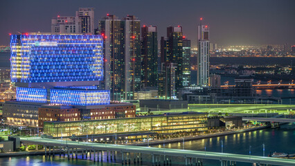 Obraz premium Aerial skyline of Abu Dhabi city centre from above day to night timelapse