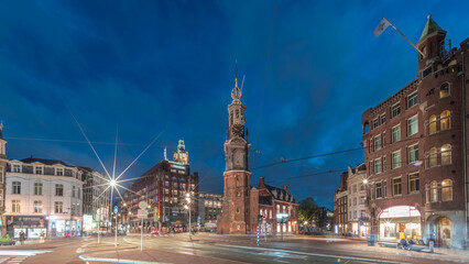 Obraz premium Munttoren tower and flowers market. Panoramic day to night timelapse hyperlapse of Amsterdam city center. Netherlands