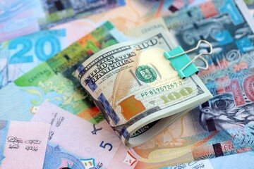 Kuwaiti dinar currency money bills and bunch of us dollar banknotes. Concept of currency exchange