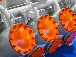 Colorful industrial valves on machinery at a manufacturing facility showcasing advanced engineering and technology