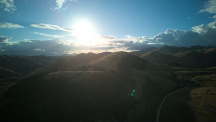 Drone aerial view of Castel del Monte, Abruzzo, a medieval hilltop village with ancient stone architecture and panoramic landscapes