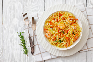 yummy spaghetti with shrimps in a white bowl