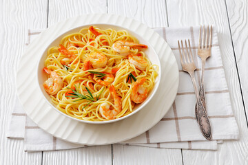 yummy spaghetti with shrimps in a white bowl