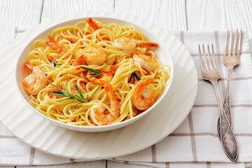 yummy spaghetti with shrimps in a white bowl