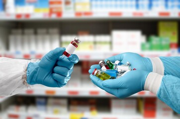 Hand of a medical Researcher holding COVID-19 Vaccines.