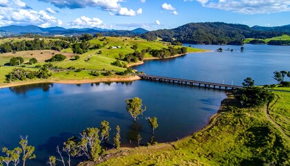 Scenic aerial view of a lake and bridge across a valley
