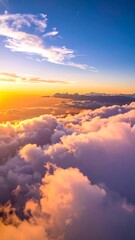 Fototapeta premium Sunset over fluffy clouds, with blue skies and warm colors