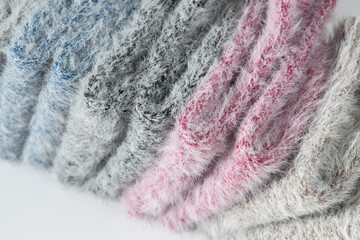 Luxurious blend of cashmere and mink fibers in pastel tones, showing soft, fluffy texture and rich detail for premium textile inspiration.