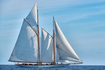 sailing ship on blue sky
