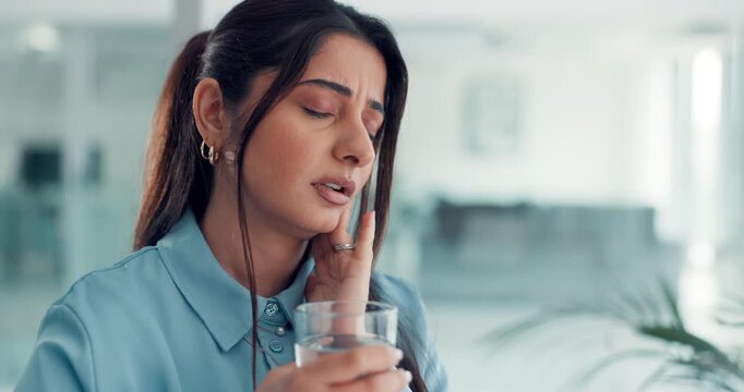 Woman, toothache and stress for pain in office with glass, water and massage for relief at media agency. Person, writer and frustrated with dental crisis, cavity or rotten teeth at creative workplace