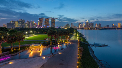 Singapore skyline panorama near Gardens by the bay with cloud forest, flower dome and supertrees...