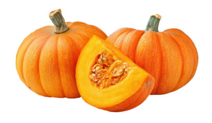 Three orange pumpkins, one sliced open with seeds, against a dark background. Perfect autumn display