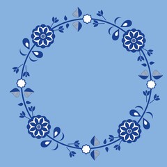 Round frame decorated with flowers.