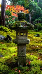 Stone lantern in a moss-covered Japanese garden, autumn leaves
