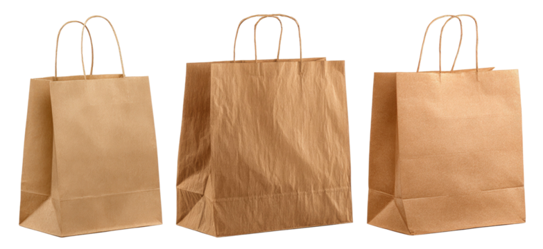 Three, slightly different sized, brown, handled paper shopping bags set against a plain black background