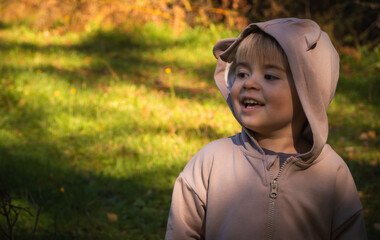 Happy child walking in the forest