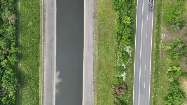 Aerial Drone View of Concrete River Channel and Road in Urban Landscape