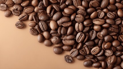 Fototapeta premium Roasted coffee beans forming a diagonal border on a brown background, offering copy space