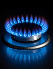 A close-up shows a blue flame, with its reflection beneath