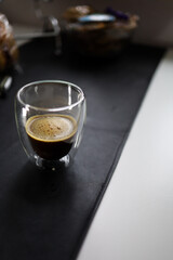 black coffee in a glass on the table