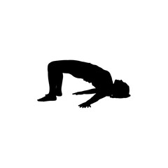 Silhouette of a person doing a yoga pose with their arms extended on the ground