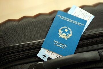 Vietnamese passport and avia tickets on travel bag. The concept of travel and vacation