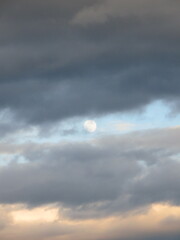 dramatic sky with clouds and the moon