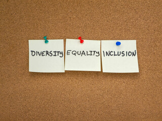 Diversity, equality, and inclusion sticky notes on cork bulletin board